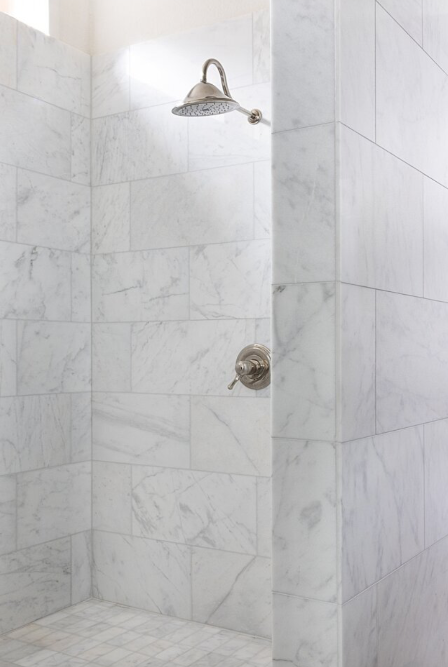 marble shower with silver shower head